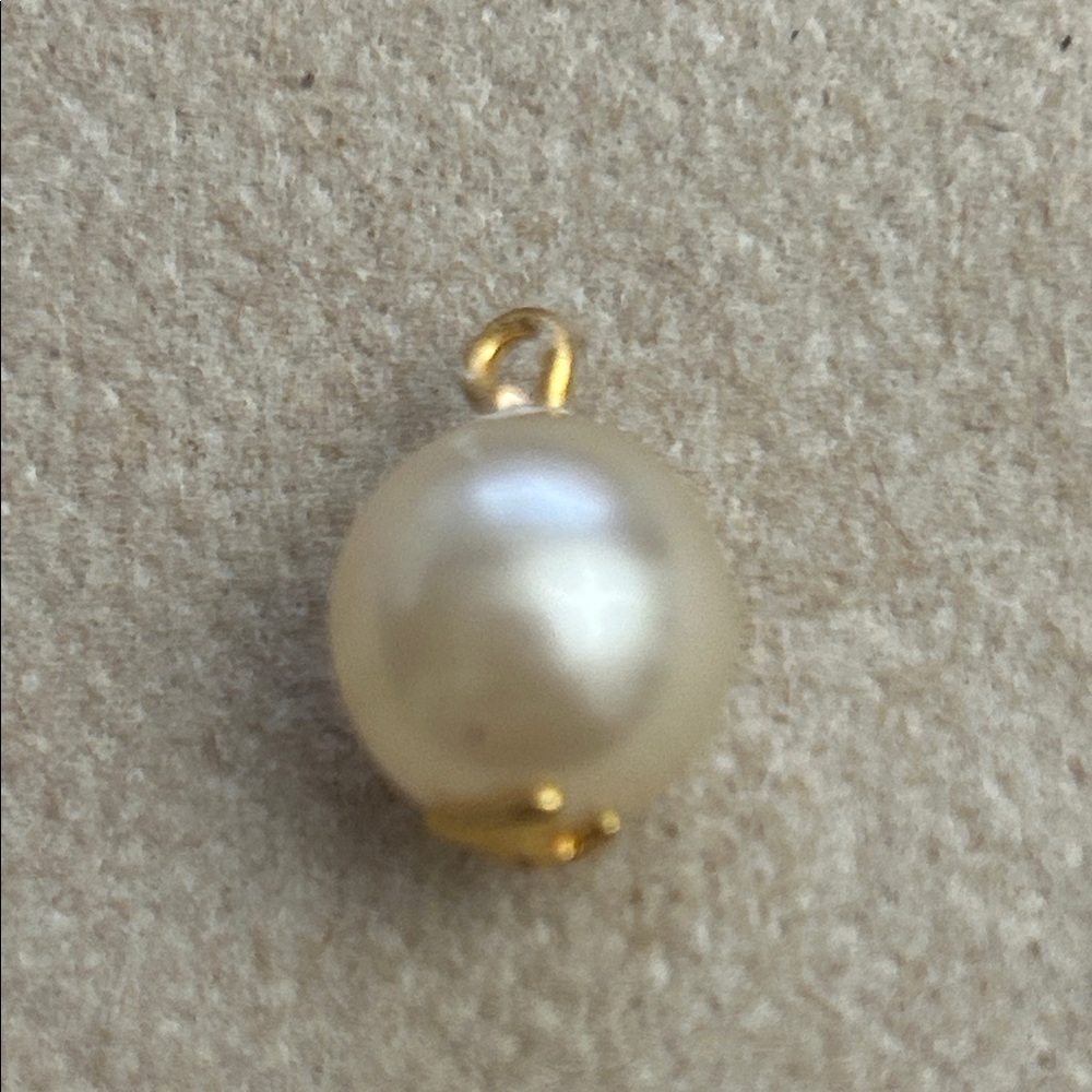 Vintage Chanel pearl with gold button or charm, pendant